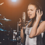 Portrait,Of,Young,Woman,Recording,A,Song,In,A,Professional